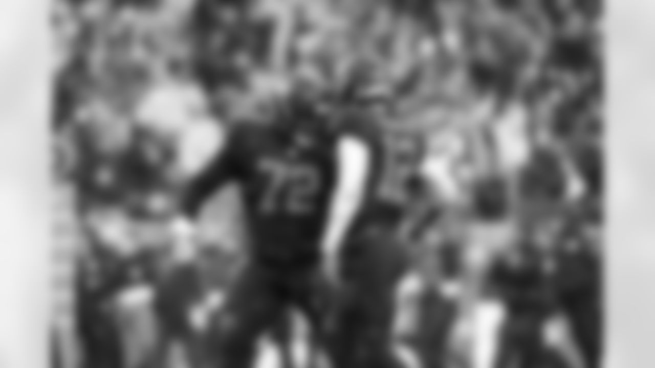 Offensive tackle KT Leveston (72) and Quarterback Shedeur Sanders (12) during a NFL football game between the Tennessee Titans and Cleveland Browns on December 7, 2025 at Huntington Bank Field.