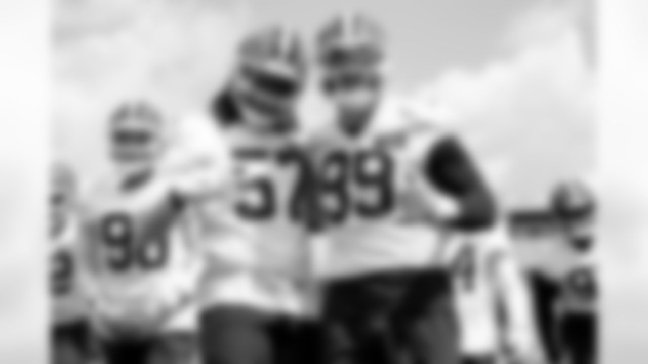 Defensive end Isaiah McGuire (57) and Defensive end Cameron Thomas (99) during the first day of mandatory minicamp at CrossCountry Mortgage Campus on June 10, 2025.