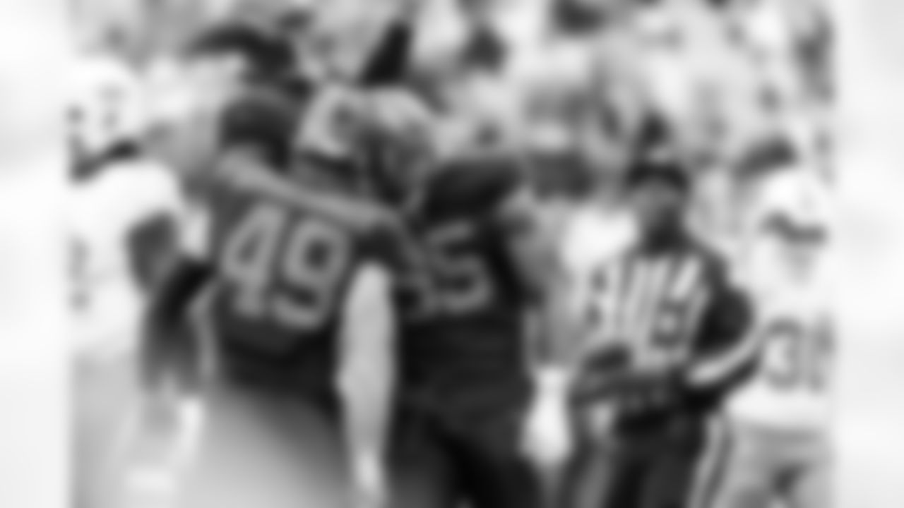 Linebacker Carson Schwesinger (49) and Defensive end Myles Garrett (95) during a NFL football game between the Miami Dolphins and Cleveland Browns on October 19, 2025 at Huntington Bank Field.