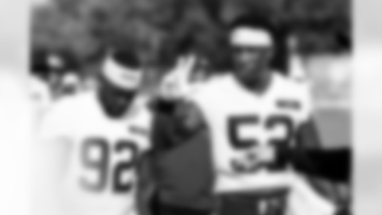 Defensive end K.J. Henry (52)