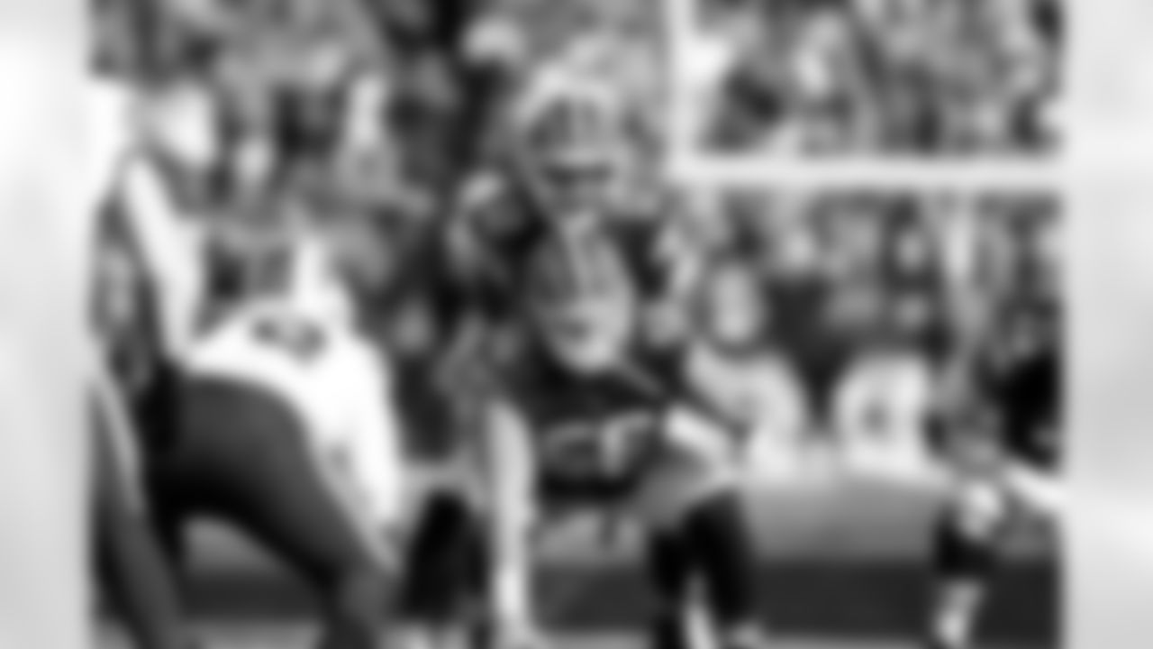 Quarterback Shedeur Sanders (12) and Center Luke Wypler (56) during a NFL football game between the Buffalo Bills and Cleveland Browns on December 21, 2025 at Huntington Bank Field.