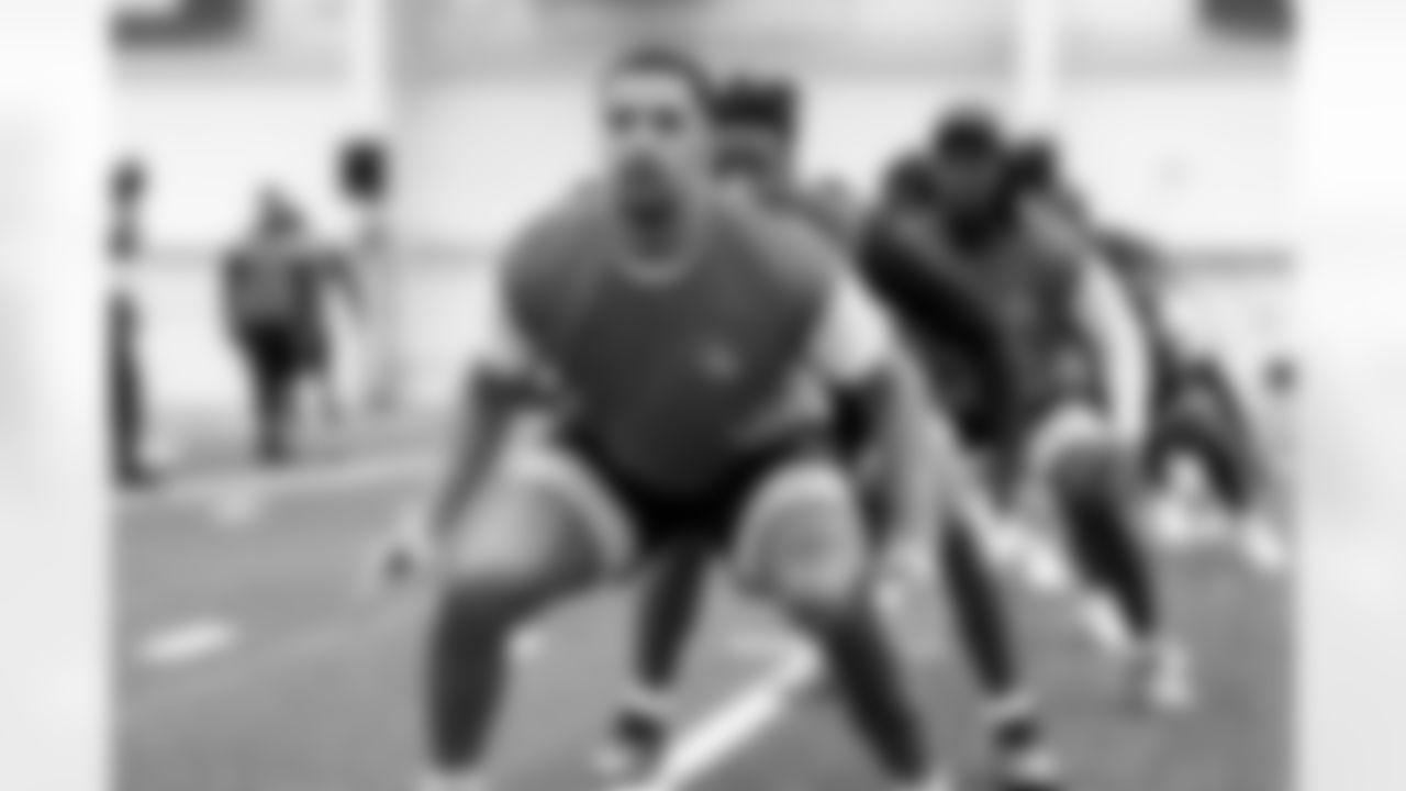Defensive end Elerson G. Smith (52) during a workout in Phase I of the offseason at CrossCountry Mortgage Campus on April 30, 2025.