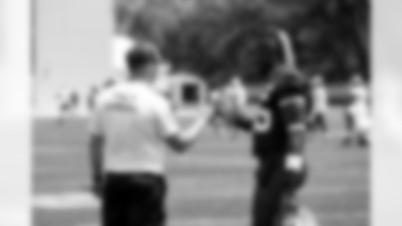 Offensive Coordinator Tommy Rees and Tight end David Njoku (85) during the first day of mandatory minicamp at CrossCountry Mortgage Campus on June 10, 2025.