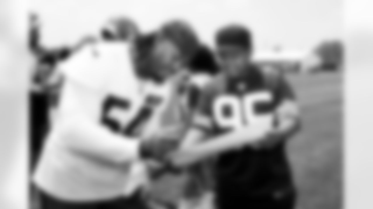 Defensive end Ogbo Okoronkwo (54) and Browns Foundation guests during the fifth day of OTAs at CrossCountry Mortgage Campus on June 4, 2025.