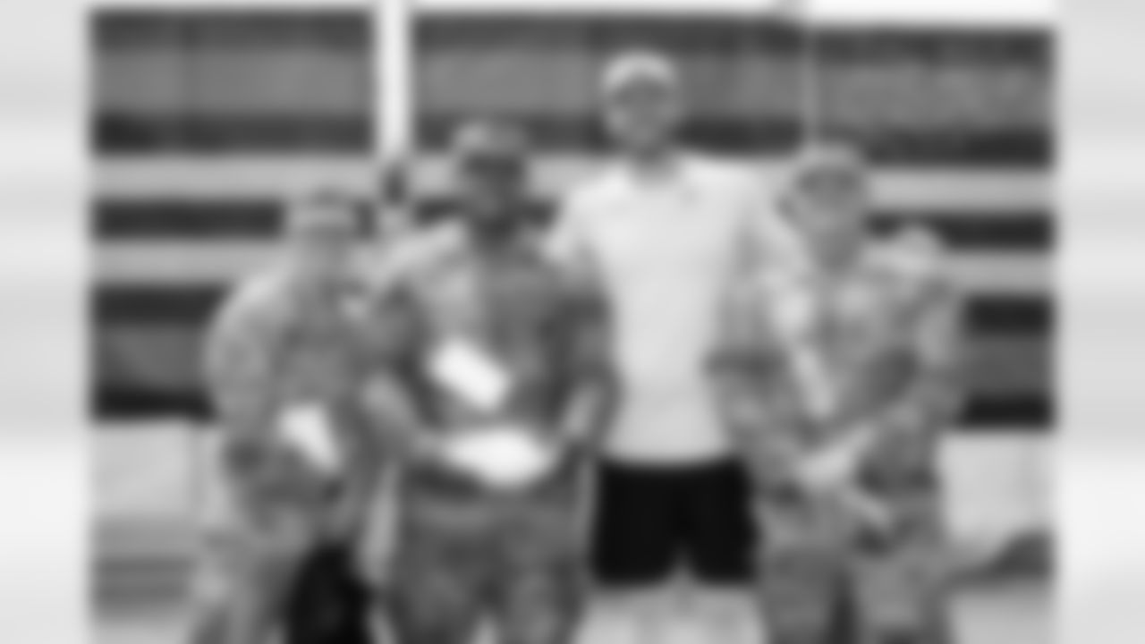 Kicker Dustin Hopkins (7) and members of the military during Day 6 of Training Camp at CrossCountry Mortgage Campus on July 29, 2025.