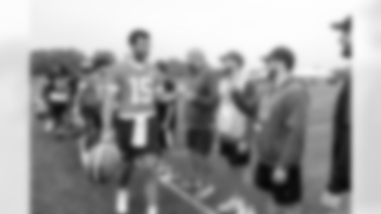 Quarterback Joe Flacco (15) and youth football guests during the sixth day of OTAs at CrossCountry Mortgage Campus on June 6, 2025.