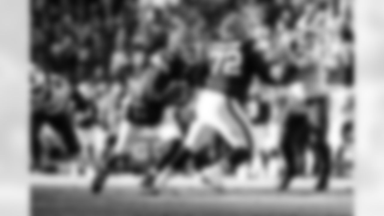 Quarterback Shedeur Sanders (12) and Offensive tackle KT Leveston (72) during a NFL football game between the Buffalo Bills and Cleveland Browns on December 21, 2025 at Huntington Bank Field.