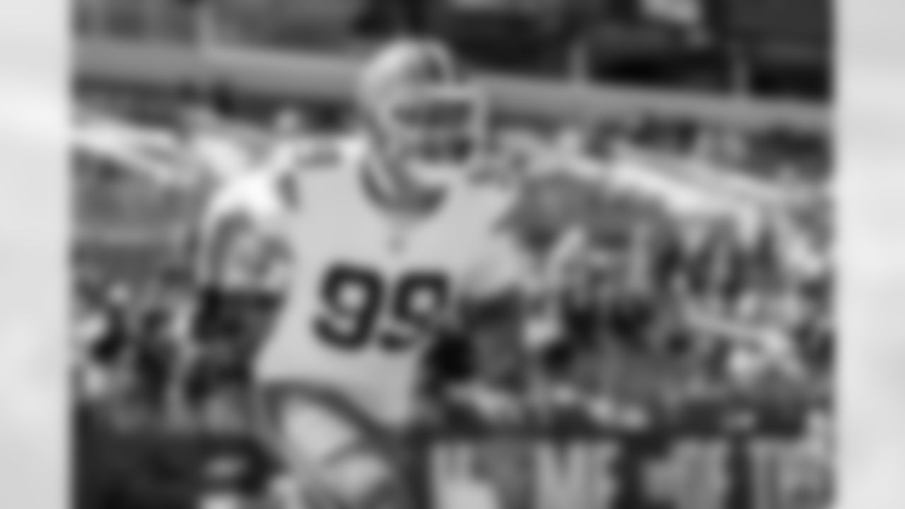 Defensive end Cameron Thomas (99)