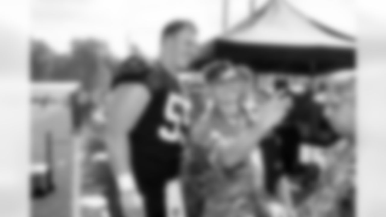 Center Ethan Pocic (55) and members of the military during Day 6 of Training Camp at CrossCountry Mortgage Campus on July 29, 2025.