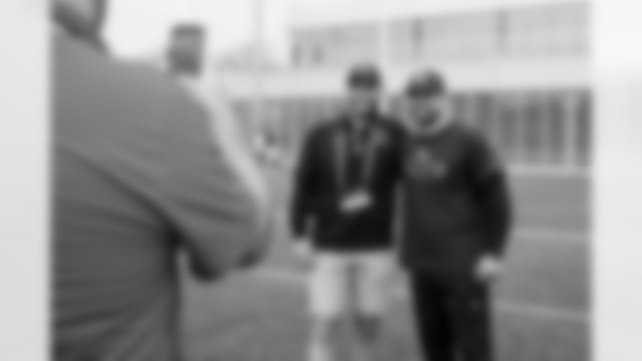 Assistant Special Teams Coach Kyle Hoke and youth football guests during the sixth day of OTAs at CrossCountry Mortgage Campus on June 6, 2025.