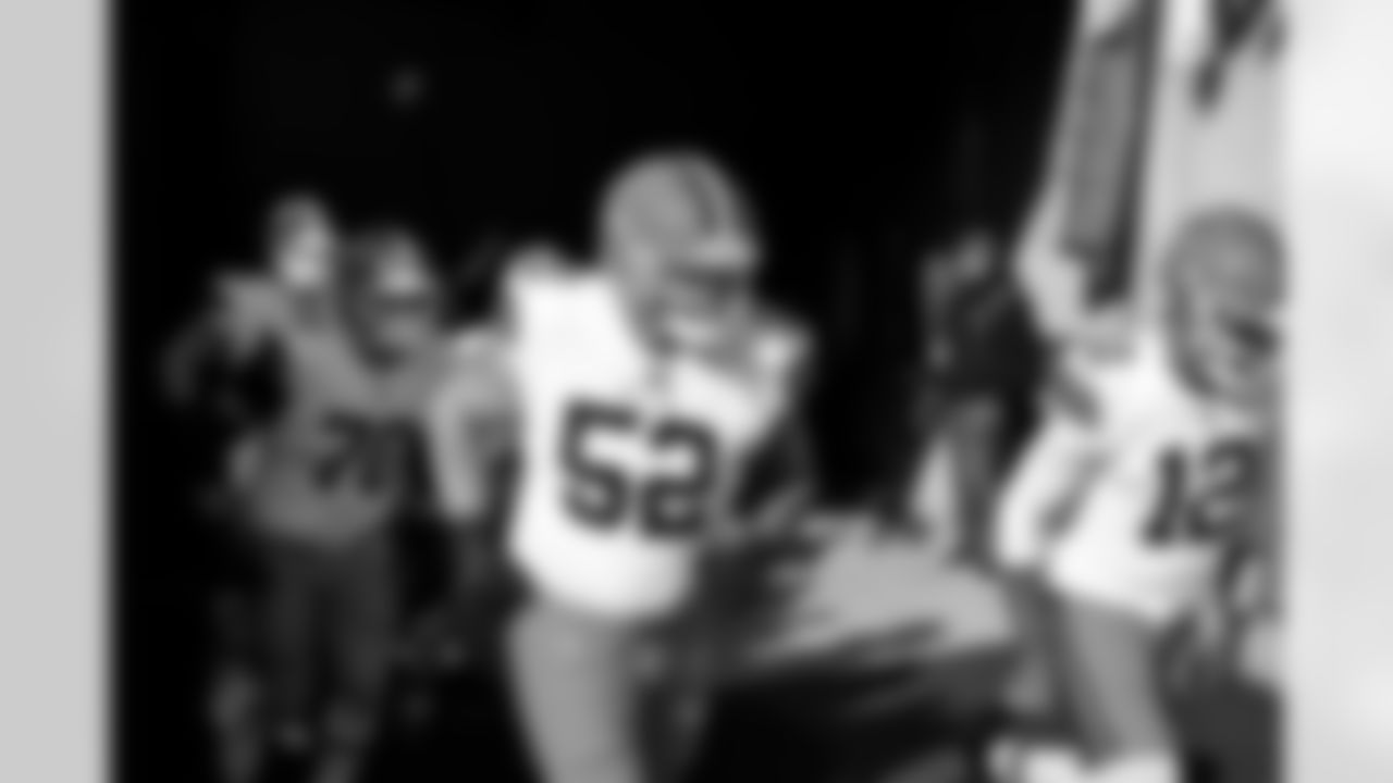 Offensive lineman Kendrick Green (52) and Quarterback Shedeur Sanders (12) before a NFL football game between the Cleveland Browns and Cincinnati Bengals on January 4, 2026 at Paycor Stadium.