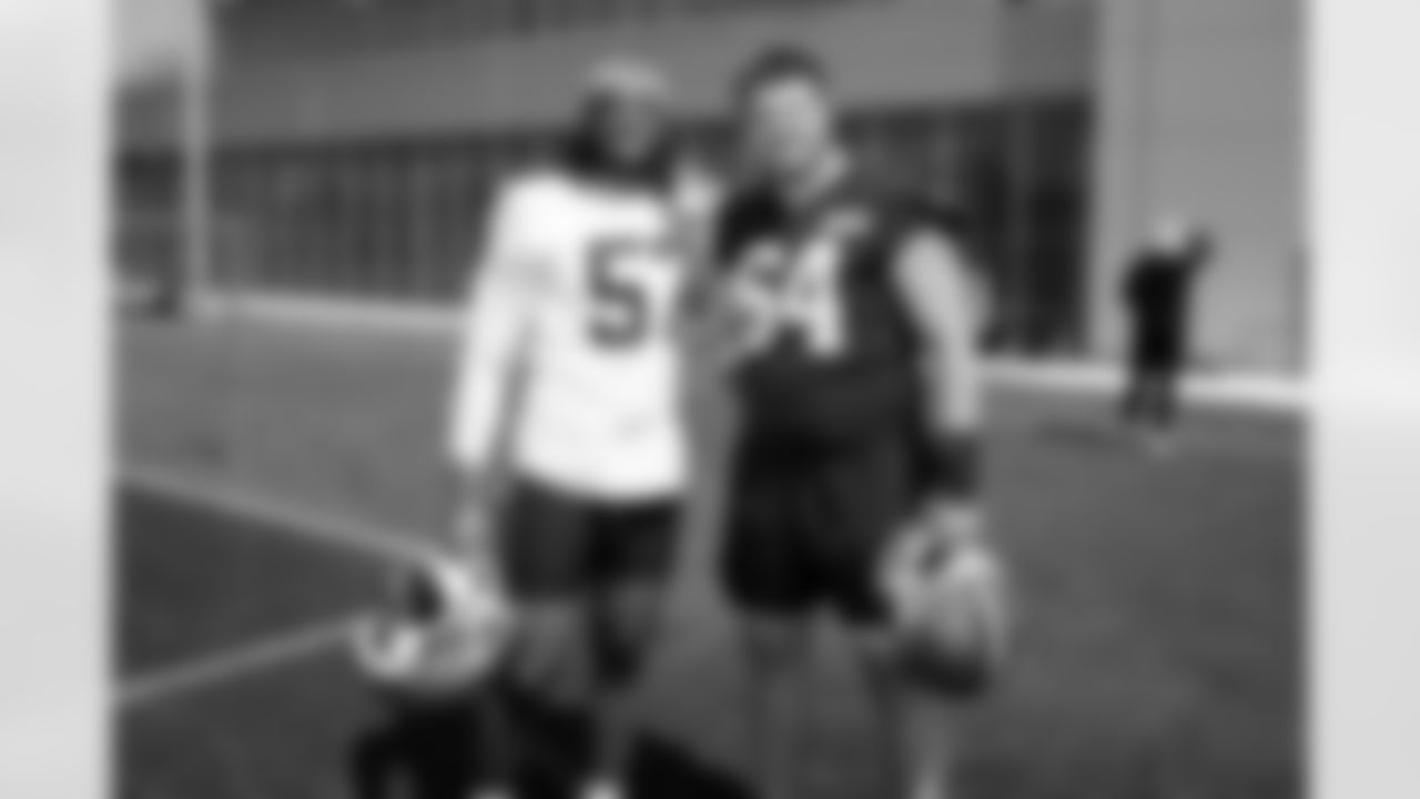 Defensive end Isaiah McGuire (57) and Offensive guard Brady Latham (64) during the second day of mandatory minicamp at CrossCountry Mortgage Campus on June 11, 2025.