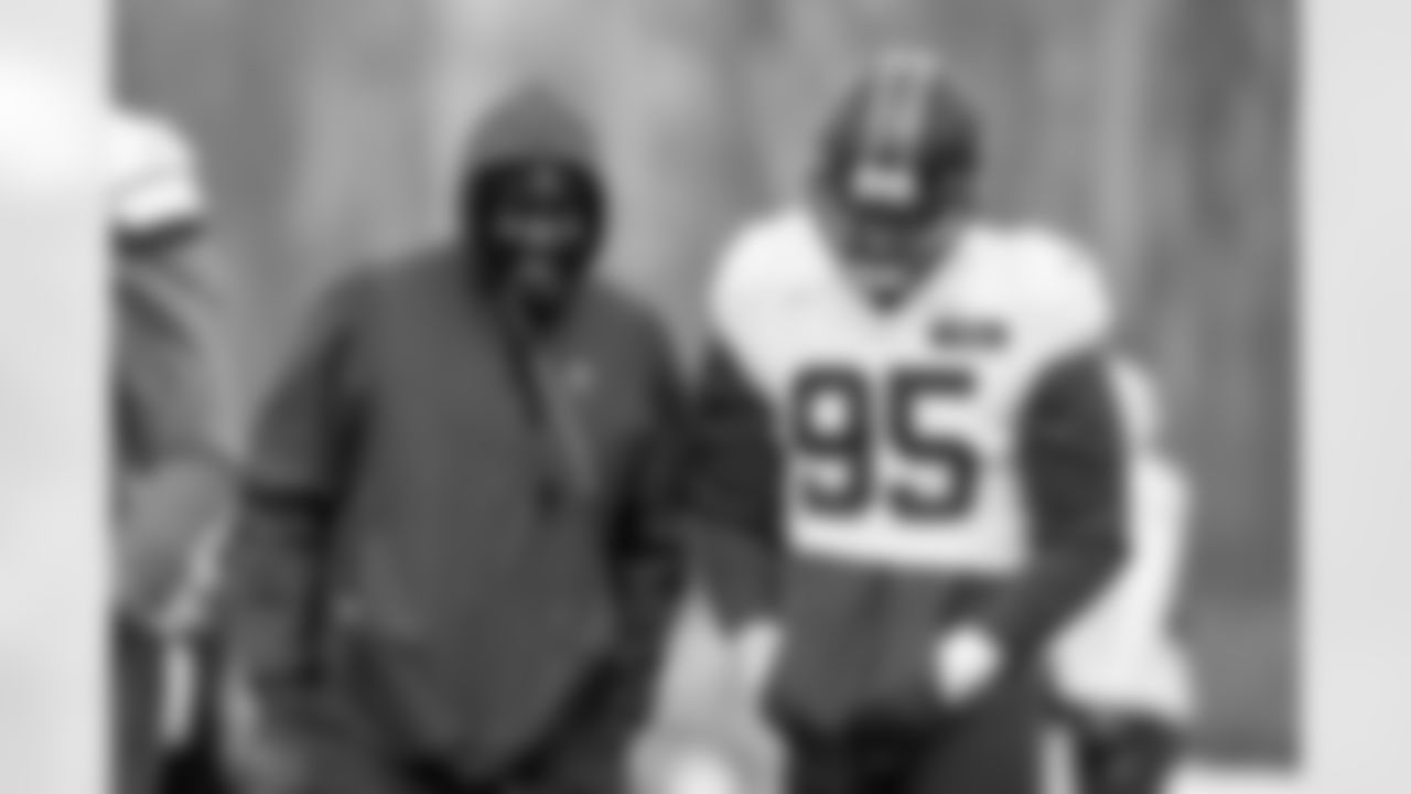 Director of Strength and Conditioning Larry Jackson and Defensive end Myles Garrett (95) during practice at CrossCountry Mortgage Campus on December 3, 2025.