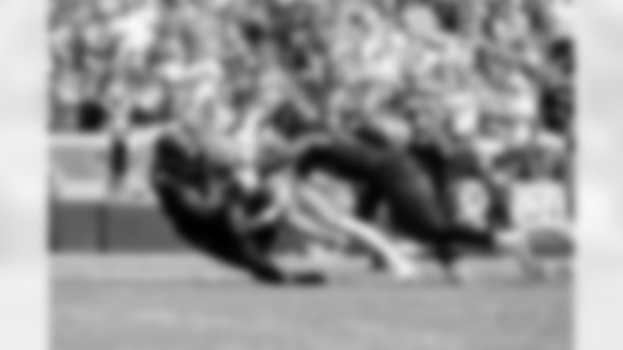 4.0 - Defensive lineman Adin Huntington (98) and Defensive end Myles Garrett (95) sack Packers Quarterback Jordan Love (10)