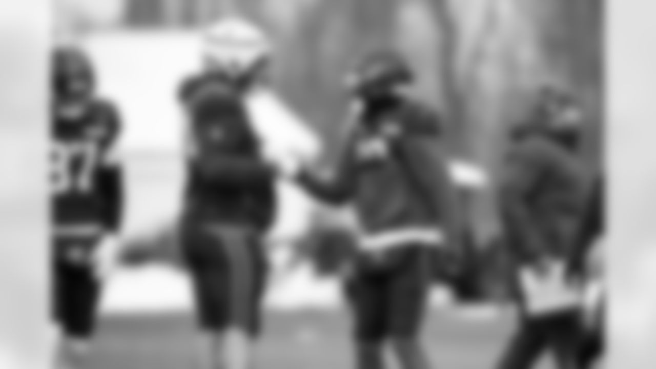 Offensive guard Teven Jenkins (74) and Wide receiver Cedric Tillman (19) during practice at CrossCountry Mortgage Campus on December 3, 2025.