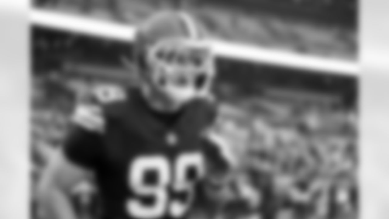 Defensive end Cameron Thomas (99)