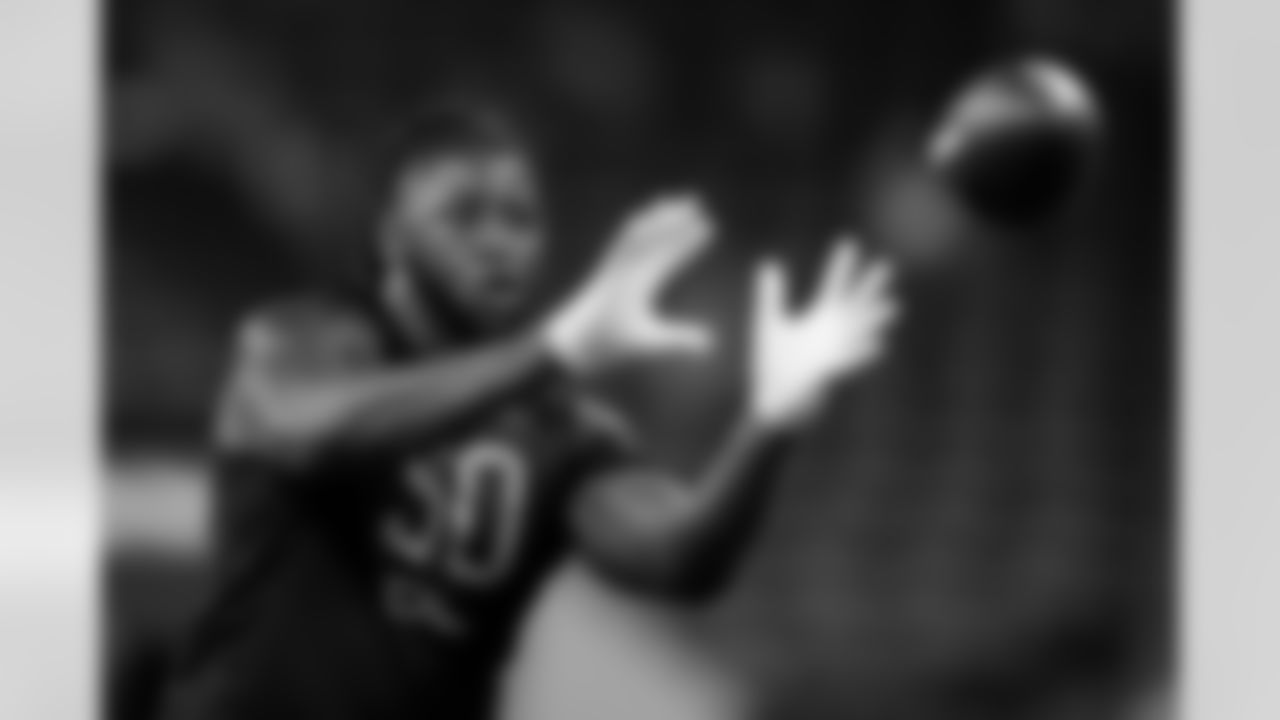 Alabama-Birmingham defensive lineman Alex Wright catches a pass during a drill at the NFL football scouting combine, Saturday, March 5, 2022, in Indianapolis. (AP Photo/Charlie Neibergall)