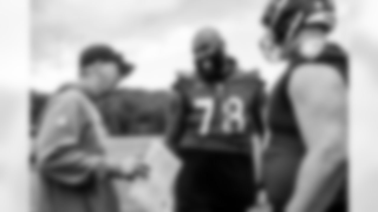 T Morgan Moses and Offensive Coordinator Todd Monken