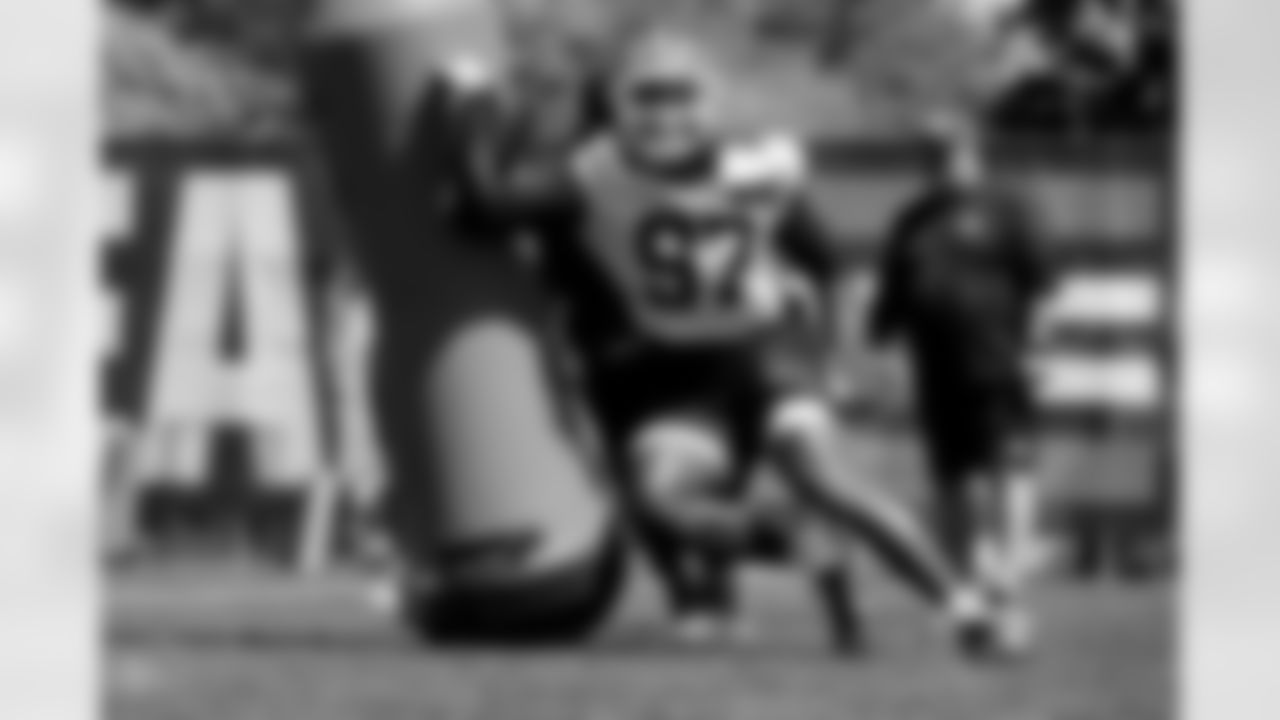 Defensive lineman John Pius (97) during fieldwork on the first day of Rookie Minicamp at CrossCountry Mortgage Campus on May 9, 2025.