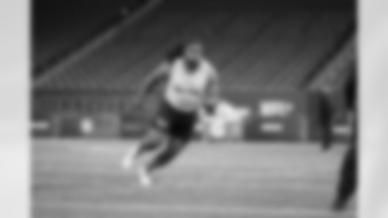 Kansas State offensive lineman KT Leveston runs a drill at the NFL football scouting combine, Sunday, March 3, 2024, in Indianapolis. (AP Photo/Michael Conroy)