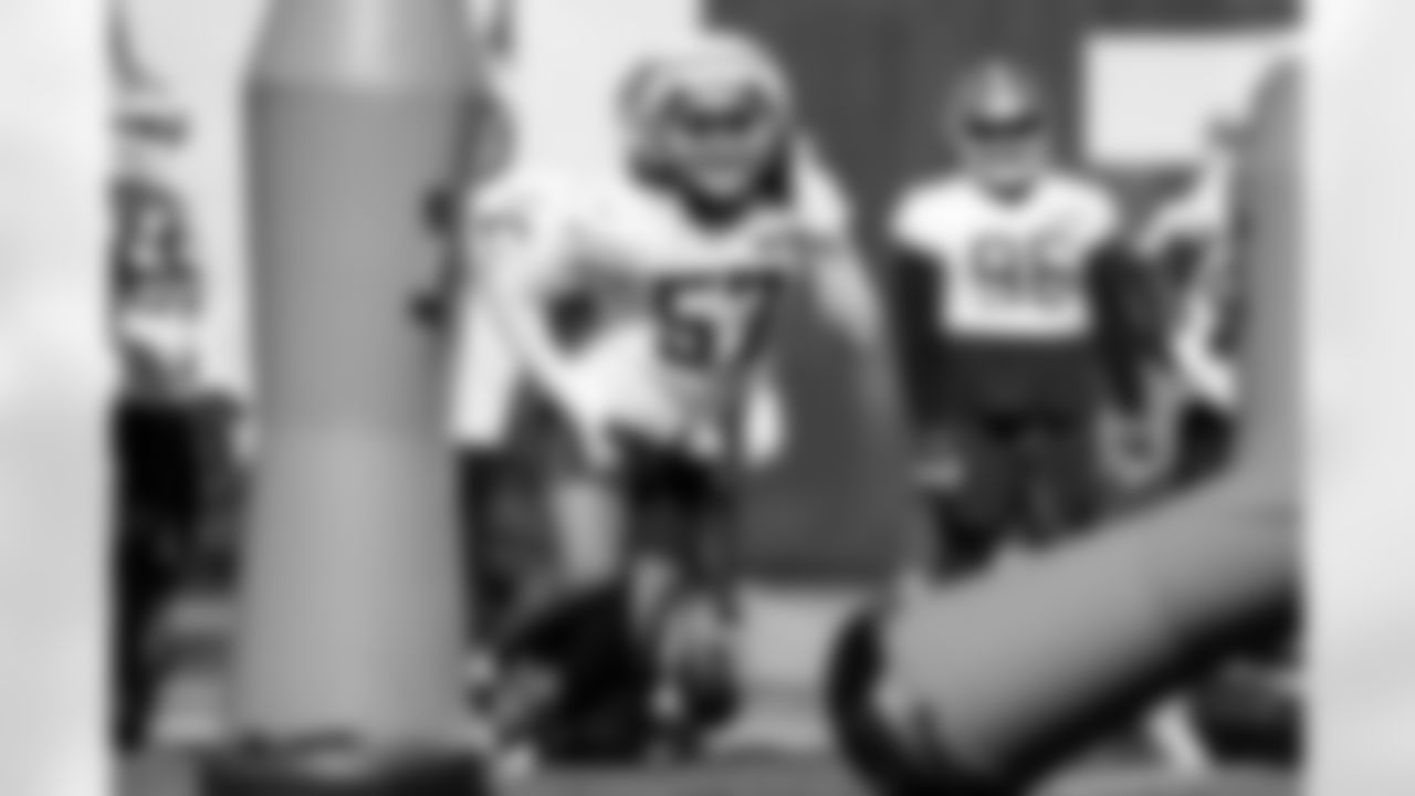 Defensive end Isaiah McGuire (57)