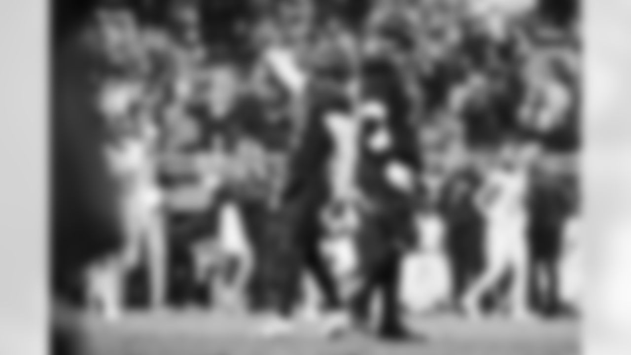 Quarterback Shedeur Sanders (12) and Offensive guard Teven Jenkins (74) during a NFL football game between the Tennessee Titans and Cleveland Browns on December 7, 2025 at Huntington Bank Field.