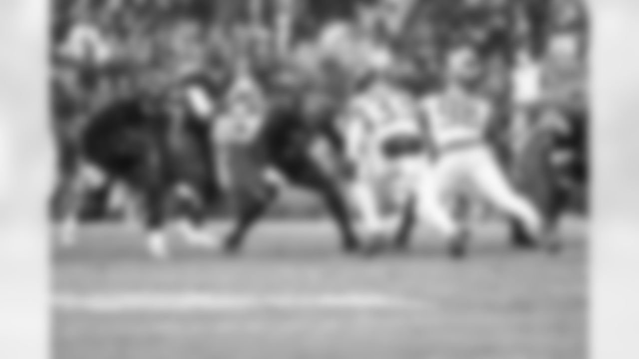 Offensive tackle KT Leveston (72), Quarterback Shedeur Sanders (12), and Offensive guard Teven Jenkins (74) during a NFL football game between the Tennessee Titans and Cleveland Browns on December 7, 2025 at Huntington Bank Field.