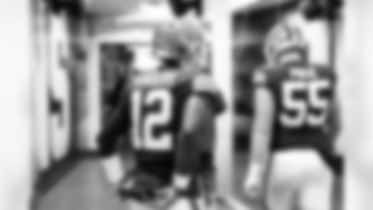Quarterback Shedeur Sanders (12) and Center Ethan Pocic (55) before a NFL football game between the San Francisco 49ers and Cleveland Browns on November 30, 2025 at Huntington Bank Field.