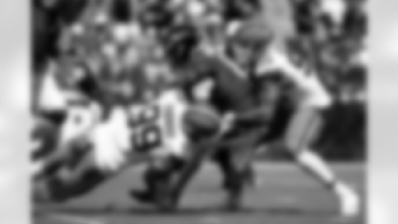 2.5 - Defensive end Cameron Thomas (99) and Defensive end Myles Garrett (95) sack Ravens Quarterback Lamar Jackson (8)