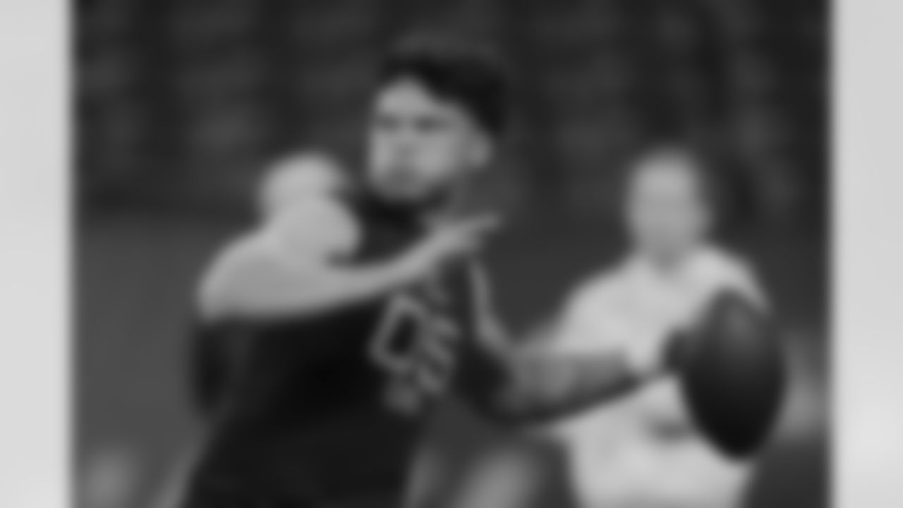 Oregon quarterback Dillon Gabriel runs a drill at the NFL football scouting combine in Indianapolis, Saturday, March 1, 2025. (AP Photo/Michael Conroy)