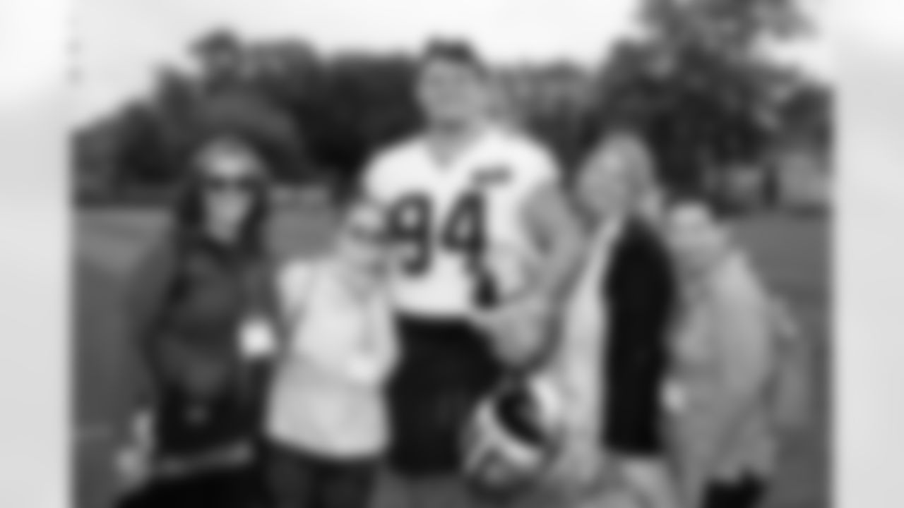 Defensive tackle Mason Graham (94) and community guests during the first day of OTAs at CrossCountry Mortgage Campus on May 28, 2025.