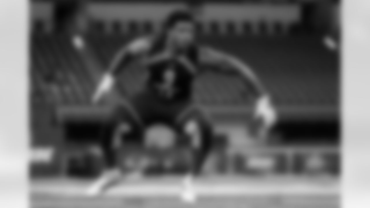 FILE - In this March 3, 2019, file photo, Michigan linebacker Devin Bush runs a drill at the NFL football scouting combine, in Indianapolis. Bush is a possible pick in the 2019 NFL Draft. (AP Photo/Michael Conroy, File)