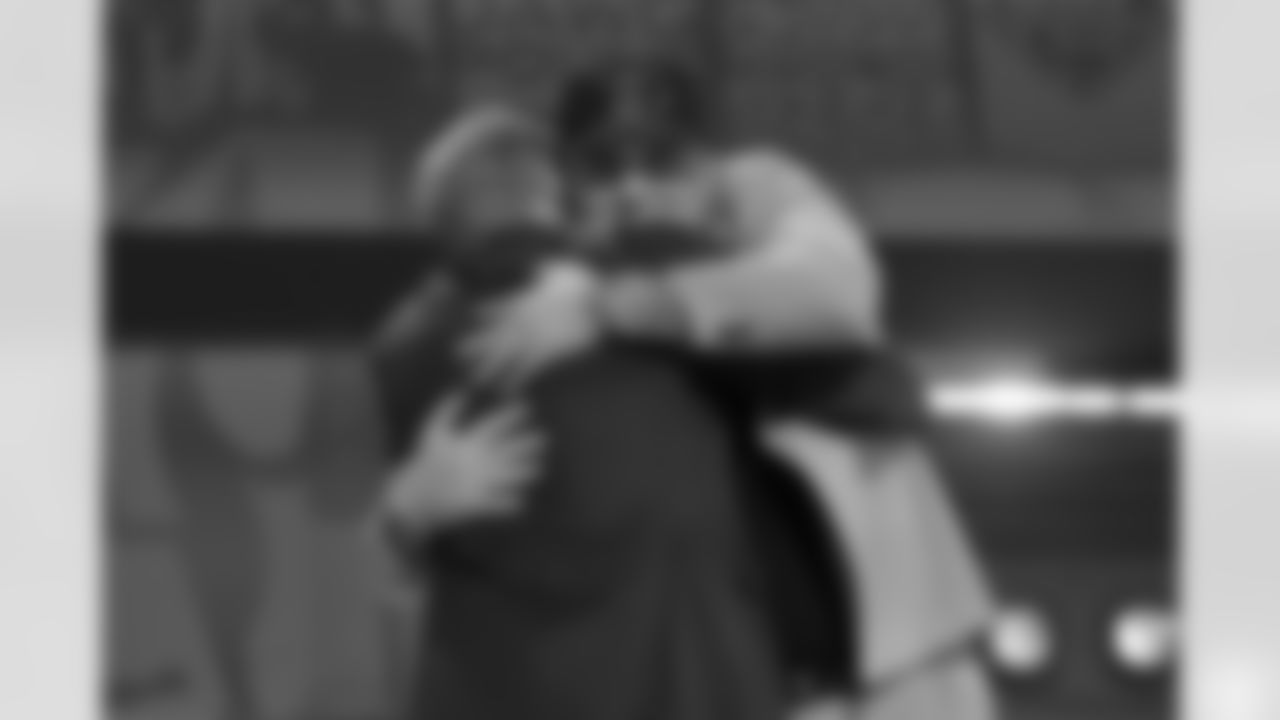 Michigan defensive lineman Mason Graham embraces NFL Commissioner Roger Goodell after being chosen by the Cleveland Browns with the fifth overall pick during the first round of the NFL football draft, Thursday, April 24, 2025, in Green Bay, Wis. (AP Photo/Jeff Roberson)