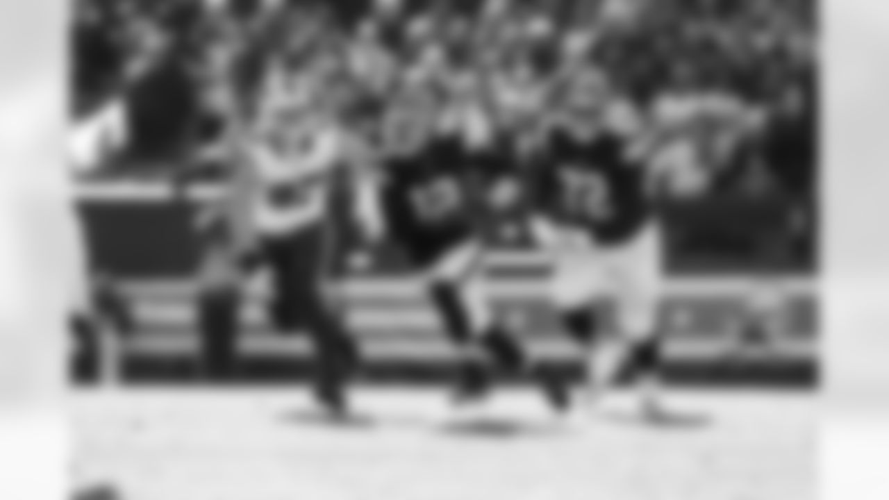Quarterback Shedeur Sanders (12) and Offensive tackle KT Leveston (72) during a NFL football game between the Buffalo Bills and Cleveland Browns on December 21, 2025 at Huntington Bank Field.
