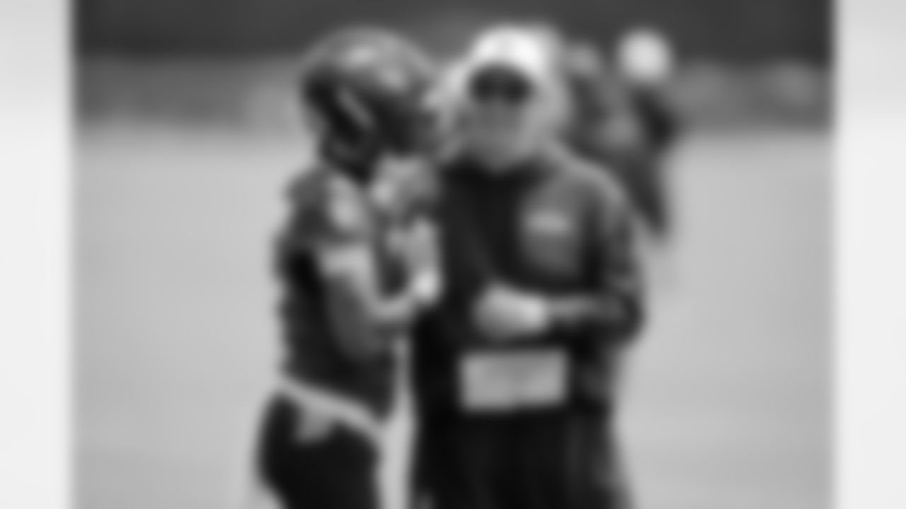 Baltimore Ravens wide receiver Zay Flowers (4) talks with offensive coordinator Todd Monken, right, during an NFL football practice, Thursday, June 5, 2025, at the Under Armour Performance Center in Owings Mills, Md. (AP Photo/Stephanie Scarbrough)