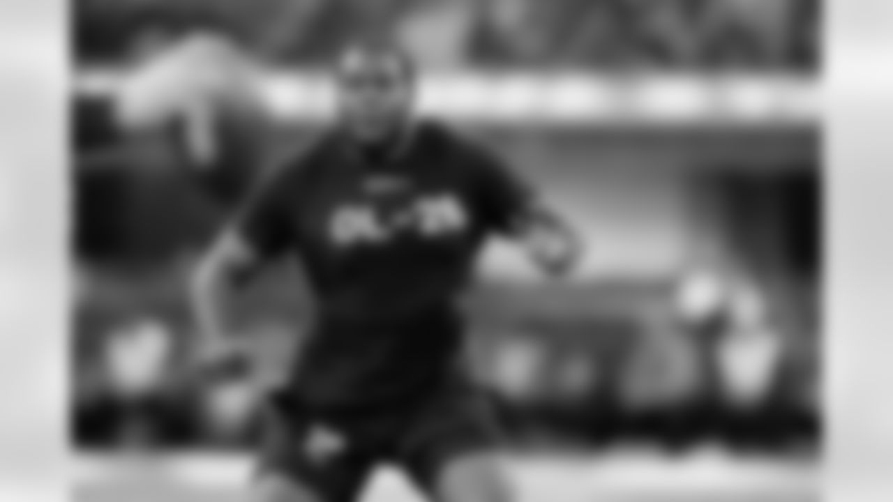 Ohio State offensive lineman Dawand Jones runs a drill at the NFL football scouting combine in Indianapolis, Sunday, March 5, 2023. (AP Photo/Darron Cummings)