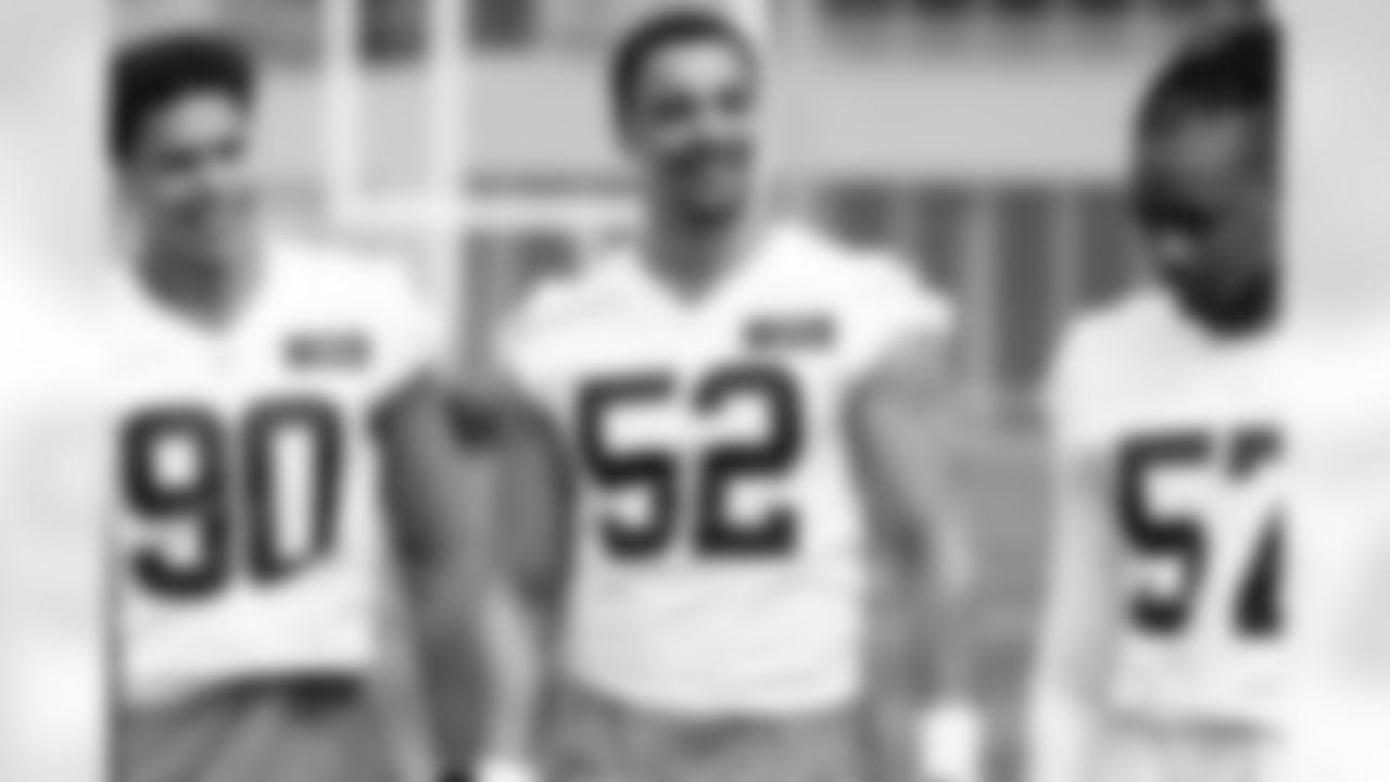 Defensive end Elerson G. Smith (52) during fieldwork in Phase II of the offseason at CrossCountry Mortgage Campus on May 12, 2025.