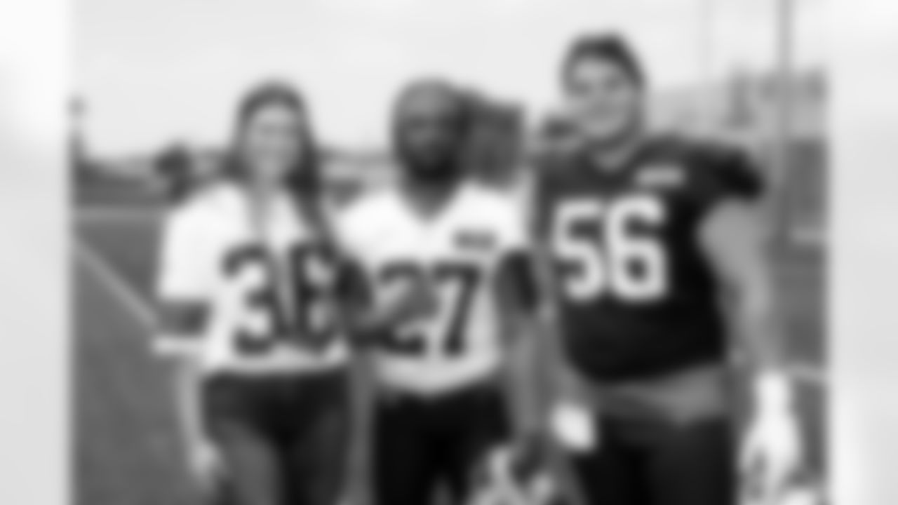 Cornerback LaMareon James (27), Center Luke Wypler (56) and Browns Foundation guests during the fifth day of OTAs at CrossCountry Mortgage Campus on June 4, 2025.