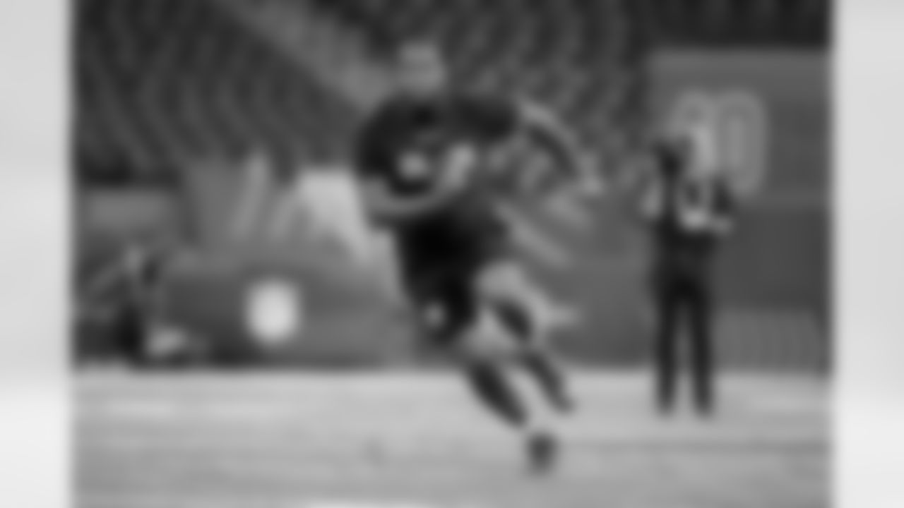 Ohio State offensive lineman Dawand Jones runs a drill at the NFL football scouting combine in Indianapolis, Sunday, March 5, 2023. (AP Photo/Darron Cummings)