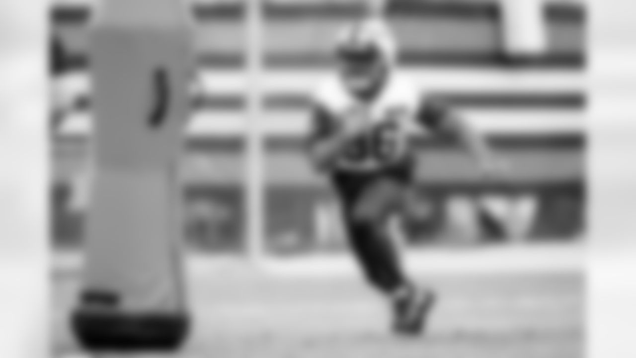 Running back Jacob Kibodi (36) during practice at CrossCountry Mortgage Campus on December 19, 2024.