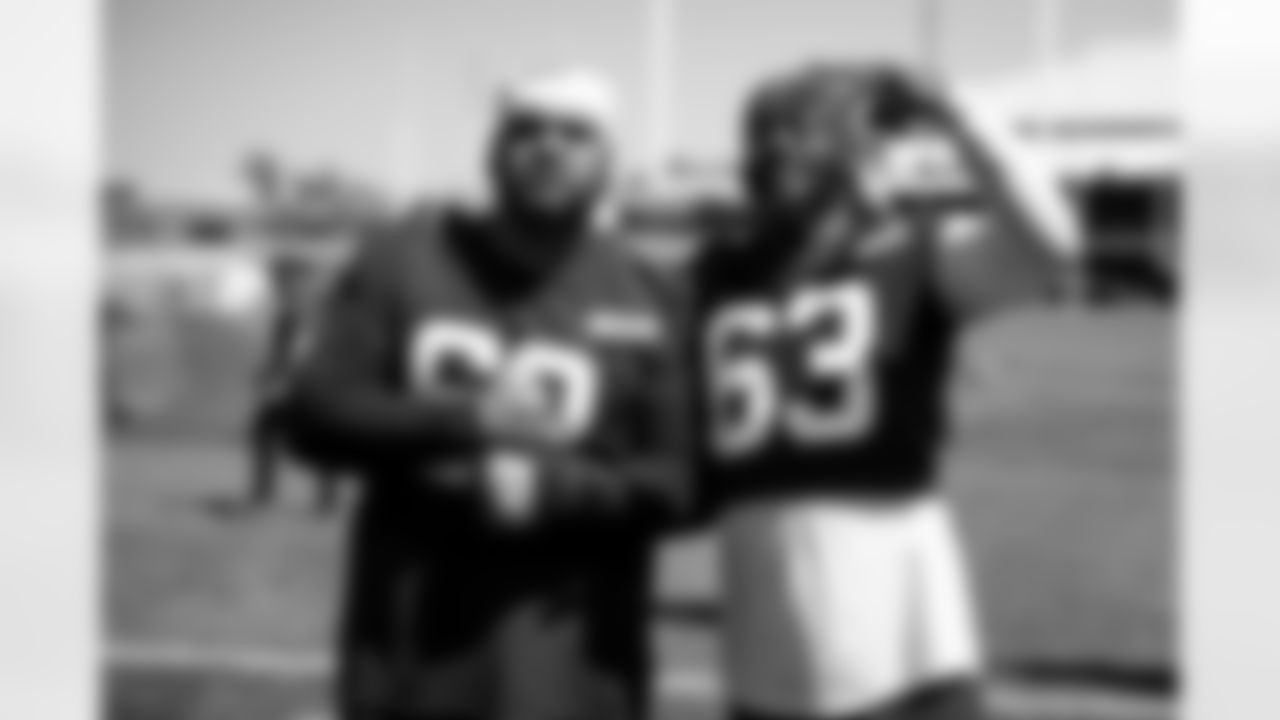 Defensive tackle Siaki Ika (62) and Defensive end Lonnie Phelps (63) during OTA 1 at CrossCountry Mortgage Campus on May 21, 2024.