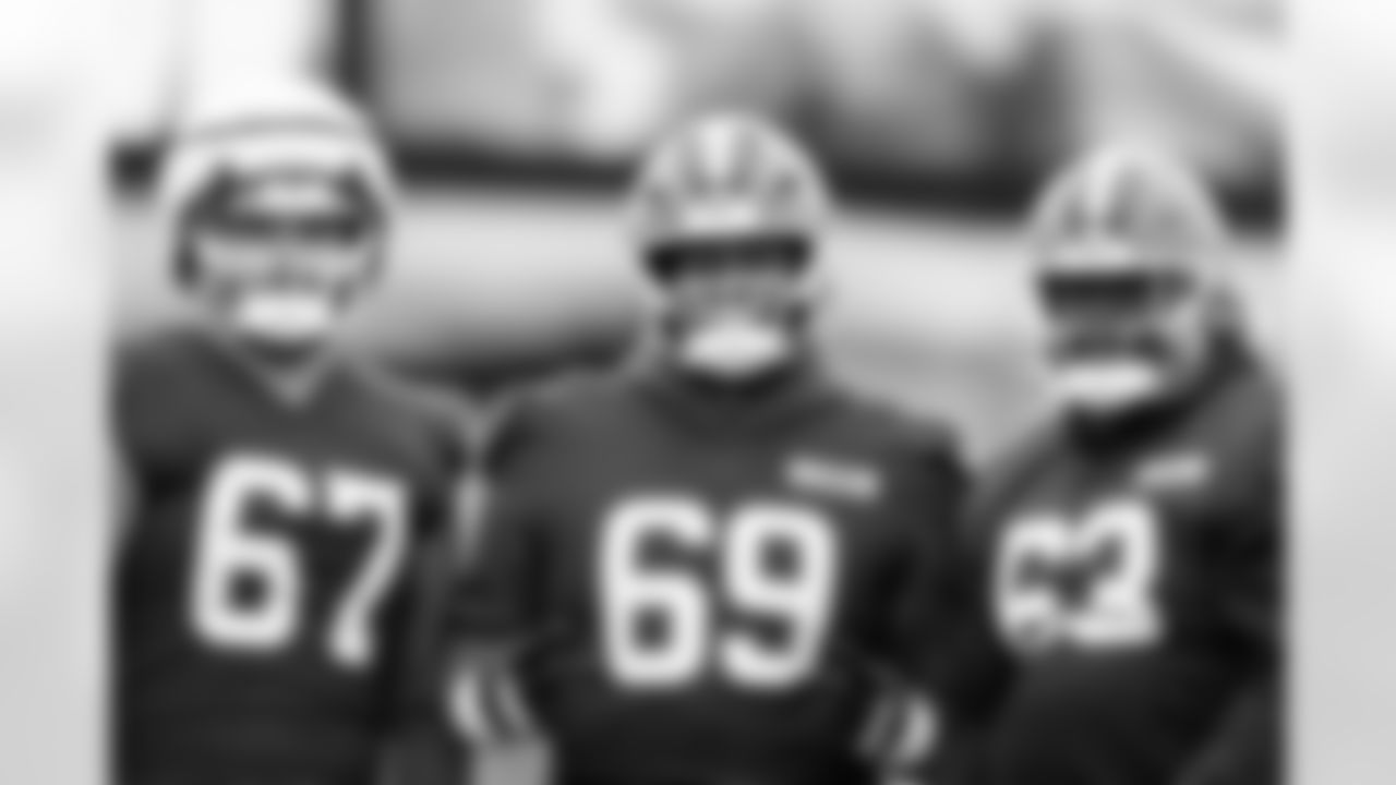 Offensive guard Jack Conley (67), Offensive tackle Tyre Phillip (69) and Offensive tackle Jeremiah Byers (63) during practice at CrossCountry Mortgage Campus on December 26, 2025.