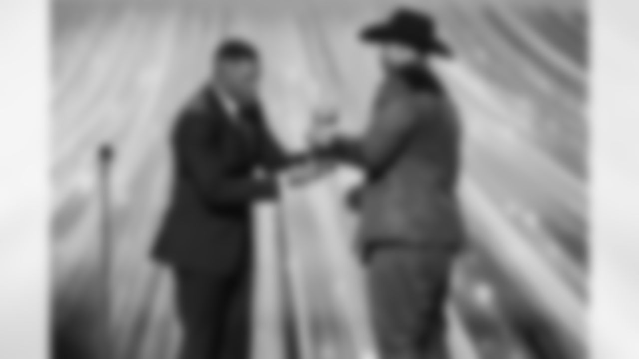 Michael Strahan present Cleveland Browns defensive end Myles Garrett (95) with the award for AP Defensive Player of the Year during the NFL Honors awards show on Thursday, February 5, 2026 in San Francisco, California.