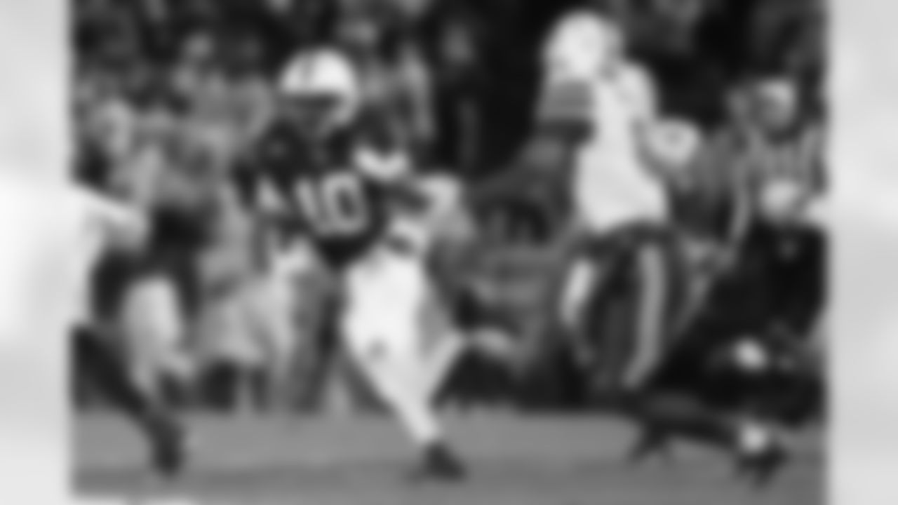 Penn State running back Nicholas Singleton (10) runs while being chased by Nebraska defensive back Deshon Singleton (8) during the second quarter of an NCAA college football game, Saturday, Nov. 22, 2025, in State College, Pa. (AP Photo/Barry Reeger)