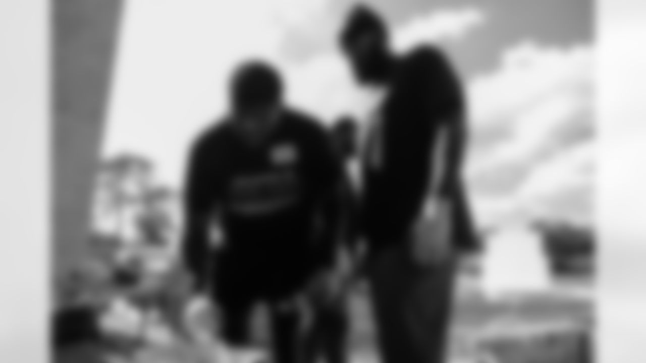 TAMPA, FL - November 18, 2025 - Outside Linebacker Yaya Diaby #0 and Tight End Devin Culp #82 of the Tampa Bay Buccaneers during a home build with Habitat for Humanity of Tampa Bay Hillsborough. Photo By Doug DeFelice/Tampa Bay Buccaneers