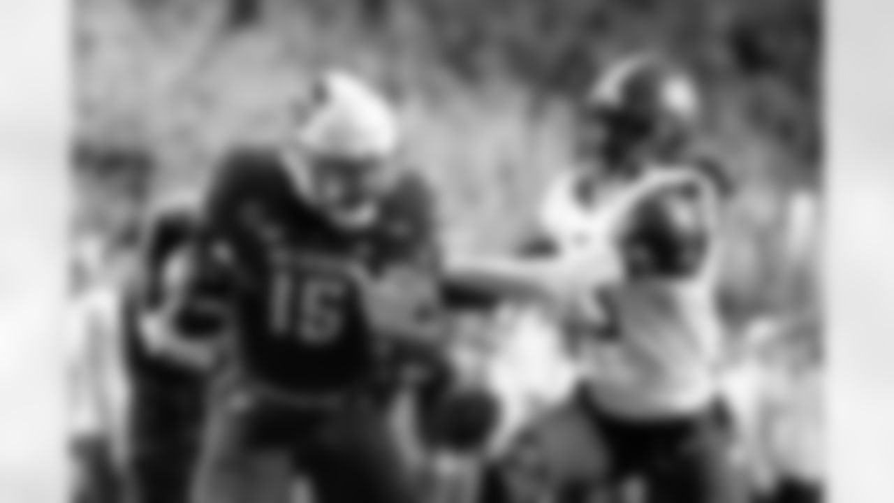 North Carolina State tight end Justin Joly (15) runs the ball away from Western Carolina's Quez Royal (13) after a catch against Western Carolina during the first half of an NCAA college football game in Raleigh, N.C., Thursday, Aug. 29, 2024. Play was negated following a penalty. (AP Photo/Karl B DeBlaker)