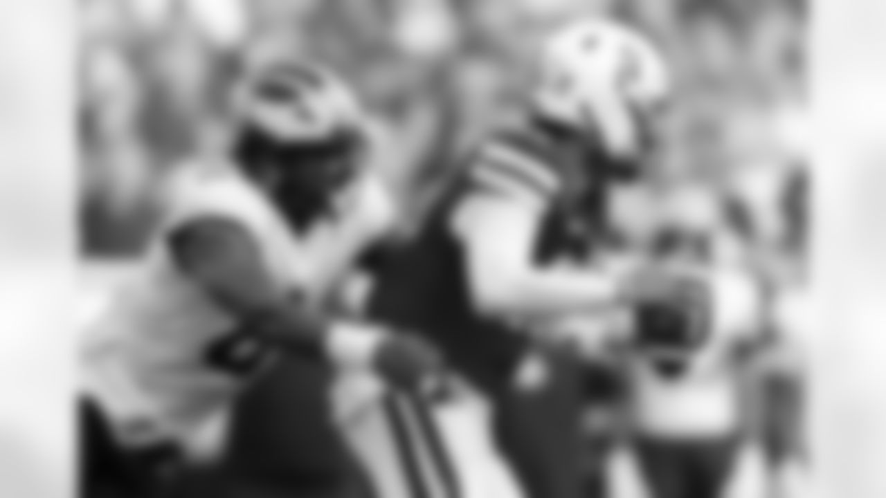 Michigan edge Derrick Moore, left, tackles Nebraska quarterback Dylan Raiola during the second half of an NCAA college football game Saturday, Sept. 20, 2025, in Lincoln, Neb. (AP Photo/Rebecca S. Gratz)