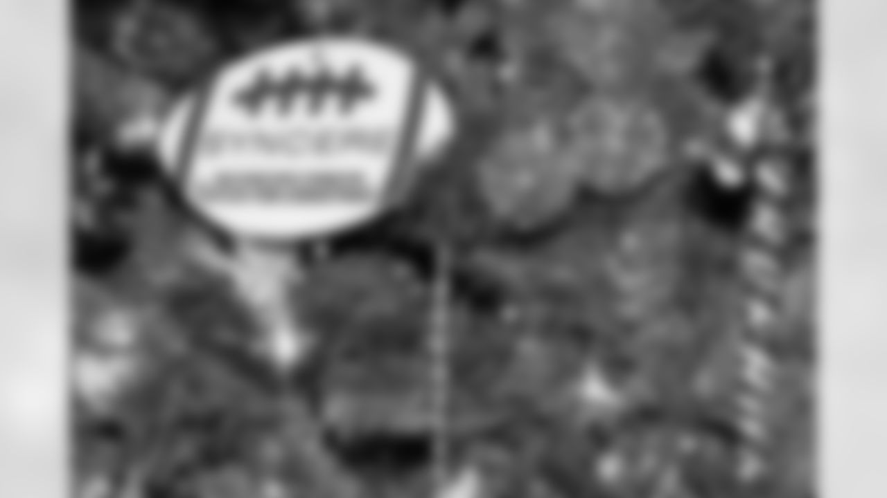 TAMPA, FL - December 05, 2025 - Mike and Ashli Evans host the Mike Evans Family Foundation 'Catch for Christmas' holiday event at AdventHealth Training Center. Photo By Kyle Zedaker/Tampa Bay Buccaneers