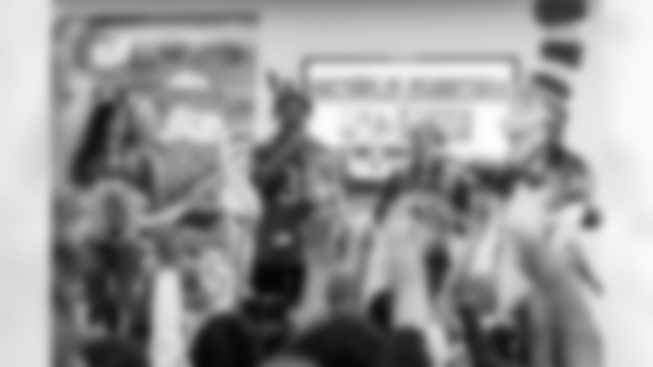 TAMPA, FL - March 03, 2026 - Safety Rashad Wisdom #38 of the Tampa Bay Buccaneers and Tampa Bay Buccaneers Cheerleaders during the National Reading Month celebration hosted by The Tampa Bay Buccaneers and Dr. Seuss Enterprises at Potter Elementary School. Photo By Doug DeFelice/Tampa Bay Buccaneers