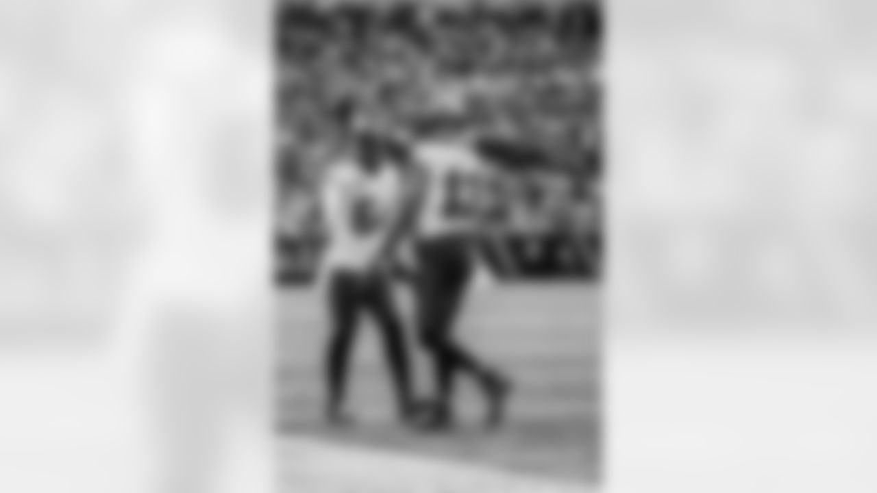 CHARLOTTE, NC - December 21, 2025 - Wide Receiver Mike Evans #13 and Inside Linebacker Lavonte David #54 of the Tampa Bay Buccaneers during the game between the Tampa Bay Buccaneers and Carolina Panthers. The Bucs lost the game, 23-20. Photo By Tori Richman/Tampa Bay Buccaneers